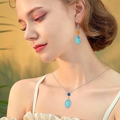 2 нити плоских овальных синтетических бирюзовых бусин TURQ-NB0001-10