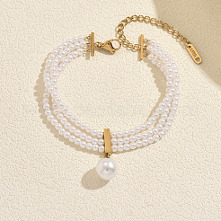 Pulseras multihilo con dije redondo de perla natural de agua dulce y cadena final de acero inoxidable.&nbsp;UK4868