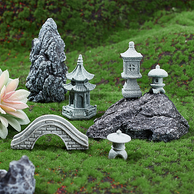 japanese stone statues in landscape