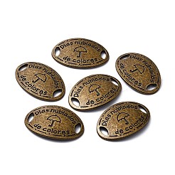 Oval aus Legierung im tibetischen Stil mit dem Wort „días nublados de colores“ und Schirmgliedern&nbsp;TIBE-Q045-11AB-NR