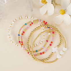 Sets aus elastischen Armbändern mit Kreuzherz aus Naturmuscheln&nbsp;XW5962